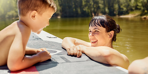 Image showing Happy, mother with child and with boat in lake together with smile for bonding time. Summer vacation or holiday break, canoe or freedom and people in a river with outdoor activity for adventure