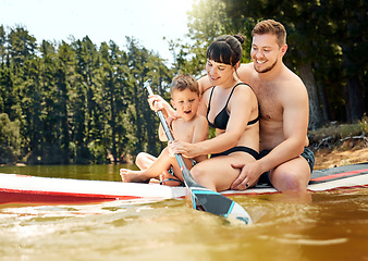 Image showing Happy, family on boat and in lake together with smile for freedom Summer vacation or holiday break, happiness or bonding time and people in a river with outdoor activity for adventure with canoe