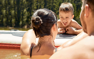 Image showing Happy, family with boat and in lake together with smile for bonding time. Summer vacation or holiday break, happiness or kayak and people in a river with canoe activity for adventure or wellness