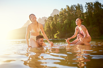 Image showing Lake, happy or friends in nature swimming with freedom, men or women in summer on camping break. Smile, funny joke or excited people outdoors in river water or dam for holiday travel or vacation trip