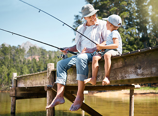 Image showing Grandfather, child and smile for fishing at lake for hobby, adventure and teaching about nature. Boy kid, happy senior man and and learning to fish for fun at river, camping trip and outdoor activity