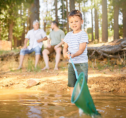Image showing Nature, fishing and child with net in river, fun and happy time on camping holiday weekend in woods. Lake, forest and relax in trees, boy catching fish in water on adventure on happy family vacation.