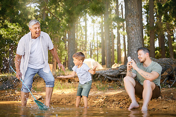 Image showing Nature, lake and child with his grandfather and father playing, fishing and bonding on a vacation. Travel, happy and senior man having fun with adult son and grandchild in the woods on a weekend trip