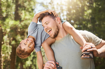 Image showing Son, father and back in outdoors with portrait for happiness for bonding and fun in summer on the weekend. Adventure, man and boy on shoulders with smile in nature for childhood with love and care.