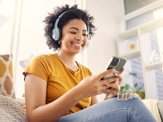 Image showing Relax, couch and woman with a cellphone, headphones and happiness with stress relief, audio and streaming music. Happy, female person and girl on a sofa, headset and smartphone with wellness and song