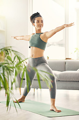 Image showing Arms, stretching and happy woman with yoga warrior pose in living room for balance, mental health or wellness at home. Body, stretch and lady smile for pilates, fitness or flexible training workout