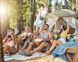 Image showing Friends, music and happiness, camping in the woods with adventure and laughing, energy and people have fun outdoor. Forest, sunshine and travel, women and men with dancing and musical instrument