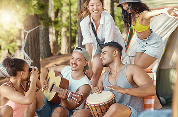 Image showing Friends, music and dancing, camping in the woods with adventure and freedom, energy and people have fun outdoor. Forest, sunshine and travel, women and men with happiness and musical instrument