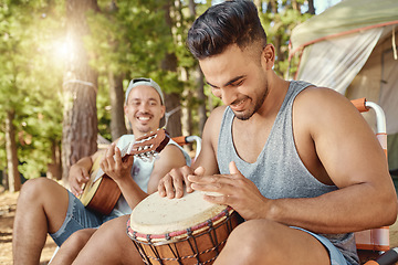 Image showing Friends, men and playing music with guitar and drum on a summer camping, holiday in the woods, forest or nature. Musician, happiness and people together for musical performance, song or band