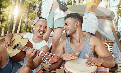 Image showing Musician, friends and playing music with guitar and drum on a summer camping, holiday in the woods, forest or nature. Men, happiness and people together for musical performance, song or band