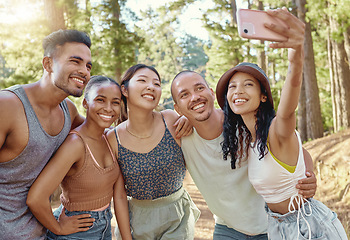 Image showing Friends in forest, camping and selfie, travel with diversity and bonding, group of people in nature and vacation. Summer, fun and happiness, men and women smile in picture, memory and relax outdoor