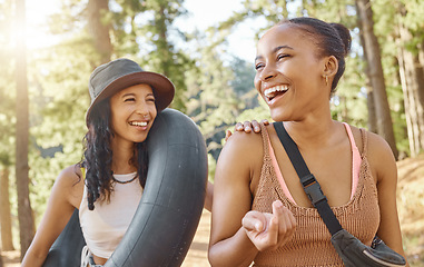 Image showing Women friends, camping and smile in woods, sunshine or funny chat on adventure, bonding and freedom on holiday. African girl, together and happy people for summer vacation, forrest and walk in nature