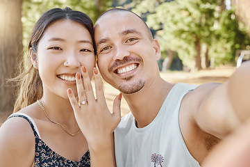 Image showing Selfie, engagement and portrait of couple in nature by outdoor park, garden or woods. Happy, smile and interracial engaged man and woman taking picture after romantic proposal with love and happiness