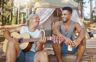 Image showing Men, friends and guitar for camping in woods with smile, singing and beer for drink, relax and holiday. Young male students, musician and happy people with instrument, creativity and art in forrest