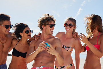 Image showing Social media, travel and friends on the beach with a phone to post a status update while on vacation together. Mobile, freedom and a group of young people outdoor in nature for summer holiday