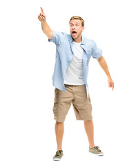 Image showing Scared, pointing finger and a man shouting in studio to for attention to show announcement space. Young male model with hand gesture or sign for warning, danger or wow surprise on a white background