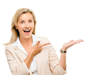 Image showing Portrait, wow and mature woman with hand pointing in studio to exciting deal or promo against white background. Finger, omg and face of excited lady with sale announcement, coming soon or menu steps