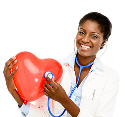 Image showing Love, woman doctor with heart balloon and against a white background with a smile. Support or care, portrait and African female surgeon isolated for health wellness against studio backdrop.