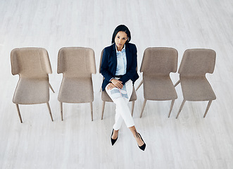 Image showing Business woman, waiting room and line of chairs for interview, hiring or recruitment at the office. Portrait of female person or employee sitting for appointment, meeting or career opportunity in row