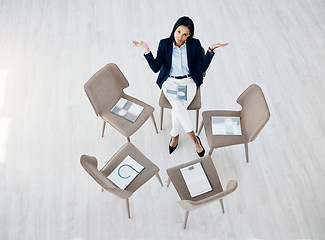 Image showing Portrait, empty and waiting for a meeting with a business woman sitting on a chair in a corporate office from above. Why, question and late with an impatient female employee alone in the workplace