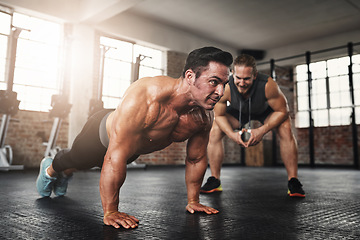 Image showing Fitness, coach and male athlete doing push up exercise for strength, health and wellness. Sports, training and man doing bodybuilding workout or challenge with personal trainer for motivation in gym.