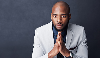 Image showing Praying, hands and business man with faith for career, job or opportunity, asking god for help and support. Corporate african person in prayer sign, religion and hope isolated on dark wall background