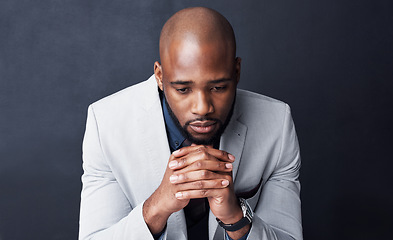 Image showing Praying, sign and business man sad for career, job or work opportunity and god help or support. Corporate african person with depression and prayer hands for religion isolated on dark wall background