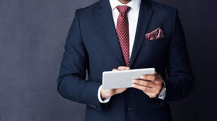 Image showing Closeup, business man or tablet in studio on mockup space of trading, planning or research on stock market website. Corporate trader, businessman and suit with digital technology of online investment