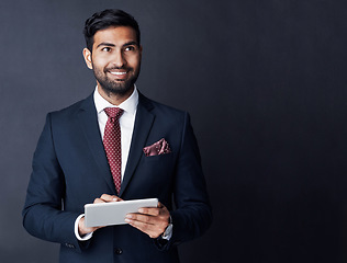 Image showing Happy businessman, tablet or thinking in studio on mockup space of trading ideas, mindset or planning goals. Corporate trader, indian man or remember decision with digital technology, vision or smile