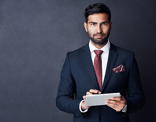 Image showing Portrait, businessman or tablet in studio, mockup space or background for trading, planning or research. Corporate trader, serious indian man in suit or digital technology of online stocks investment