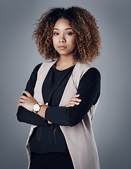 Image showing Confident, portrait of a businesswoman against a studio background for serious mindset. Empowerment or assertive, elegance or proud and female person pose for success with arms crossed in backdrop