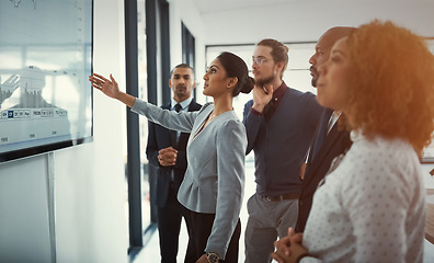 Image showing Data review, colleagues in a business meeting and planning in a boardroom of their workplace. Analytics or statistics, collaboration or teamwork and people in a office for strategy or presentation