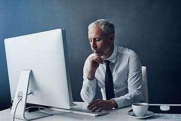 Image showing Computer, thinking and business man at desk working on online project, planning and writing email. Corporate worker, office and mature male person typing on PC monitor for review, website or research