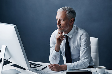 Image showing Thinking, office and business man on computer for online project, internet and browse website at desk. Technology, corporate worker and mature male person on pc for research, email and planning