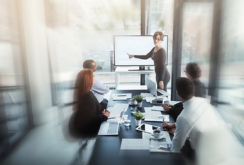 Image showing Presentation, businesswoman or speaker in a meeting for graphs report or chart analysis in a company. Motion blur, manager or mentor planning sales growth on screen monitor in training or coaching