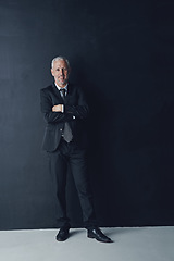 Image showing Arms crossed, smile and portrait of business man in studio for professional, corporate or manager. Boss, pride and confidence with senior male ceo on black background for executive and mockup space