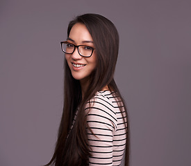 Image showing Fashion glasses, portrait and woman smile in studio isolated on a gray background mockup space. Face, nerd and female geek, person or model from Canada with trendy clothes, eyewear and casual style.