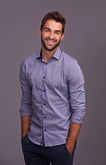 Image showing Portrait, auditor and happy business man in studio isolated on a gray background. Smile, confident and person, professional or accountant from Canada with trendy clothes, fashion and hands in pocket.