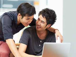 Image showing Teamwork, gay couple working with laptop and at their home together happy. Collaboration or partnership, cheerful or happiness and bisexual people with computer for social networking or connectivity