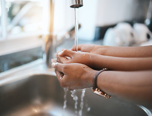 Image showing Washing hands, kitchen and parent with a child in their home for hygiene or cleaning at the sink. Children, water and tap with a kid learning about protection from an adult person in their house