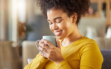 Image showing African woman, coffee and smile on sofa with scent, flavor and energy to start morning in apartment. Girl, happy and drink to relax with tea, matcha or espresso with smell, thinking and mug in house