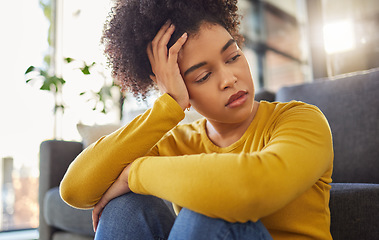 Image showing African woman, sad and thinking on living room floor with worry, stress and memory of trauma in home. Gen z girl, anxiety and remember mistake, regret and mental health problem in lounge at apartment