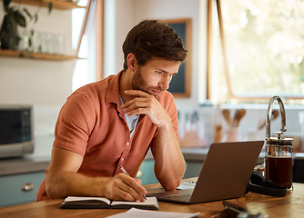 Image showing Research, laptop and remote work, man at kitchen counter reading email, social media or networking for online job. Technology, notebook and freelancer on internet, writing notes for blog or article.