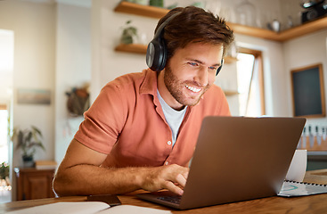 Image showing Headphones, laptop and remote work, happy man in kitchen on video call, social media meme or networking for online job. Technology, smile and freelancer on internet for webinar listening to podcast.