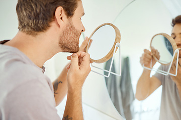 Image showing Mirror, grooming and man with a teeth check for dental health, cleaning and morning routine. Medical, healthcare and a young person looking at a tooth or mouth in a home bathroom with reflection