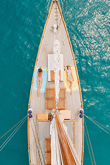 Image showing Travel, ocean and women on boat for cruise, luxury sailing and transport for holiday, vacation and trip. Relax, summer and aerial of female people on yacht for tropical journey, sunbathing or tourism