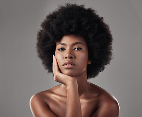 Image showing Skincare, black girl and makeup with confidence in portrait for wellness in studio background with afro. Beauty, face and glowing skin with african woman with cosmetics for dermatology with makeup.