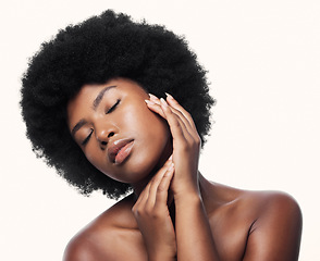 Image showing Black woman, touch face and skincare with eyes closed in studio isolated on a white background. Natural cosmetics, confidence and African model with spa treatment for aesthetic, wellness and beauty.