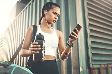 Image showing Earphones, mobile app or happy girl runner in city streaming music to start training, workout or exercise. Social media, bag or sports woman athlete listening to radio or fitness podcast to relax