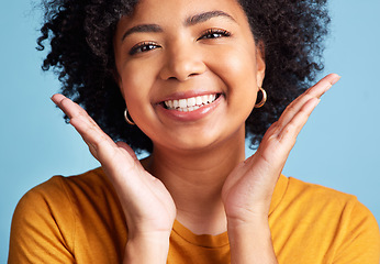 Image showing Happy, portrait of a woman with smile and against a blue background for health wellness. Happiness or satisfaction, cheerful and face of female person pose for positivity against studio backdrop